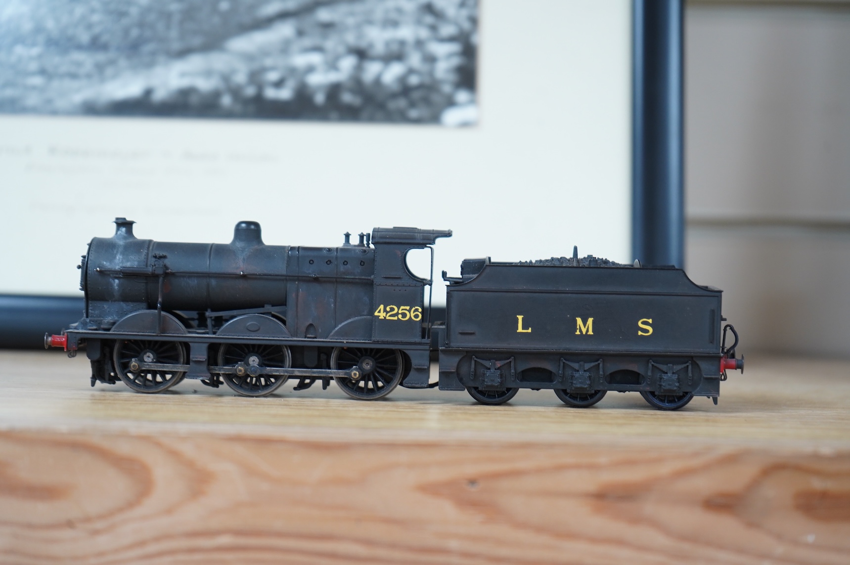 Two kit built and adapted EM gauge LMS railway locomotives; an 0-8-0, 9518, and an 0-6-0 class 4F based on an Airfix kit, together with the body only of an SR Schools Class